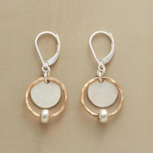 Stylish earrings made of gold and silver with pearls