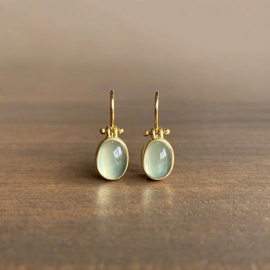 Elegant vintage earrings with radiant green moonstone
