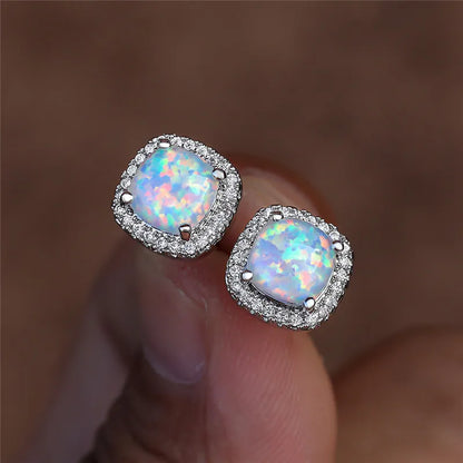 Elegant silver stud earrings with round white fire opals