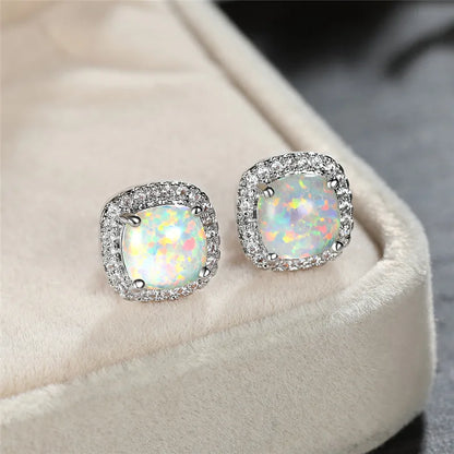 Elegant silver stud earrings with round white fire opals
