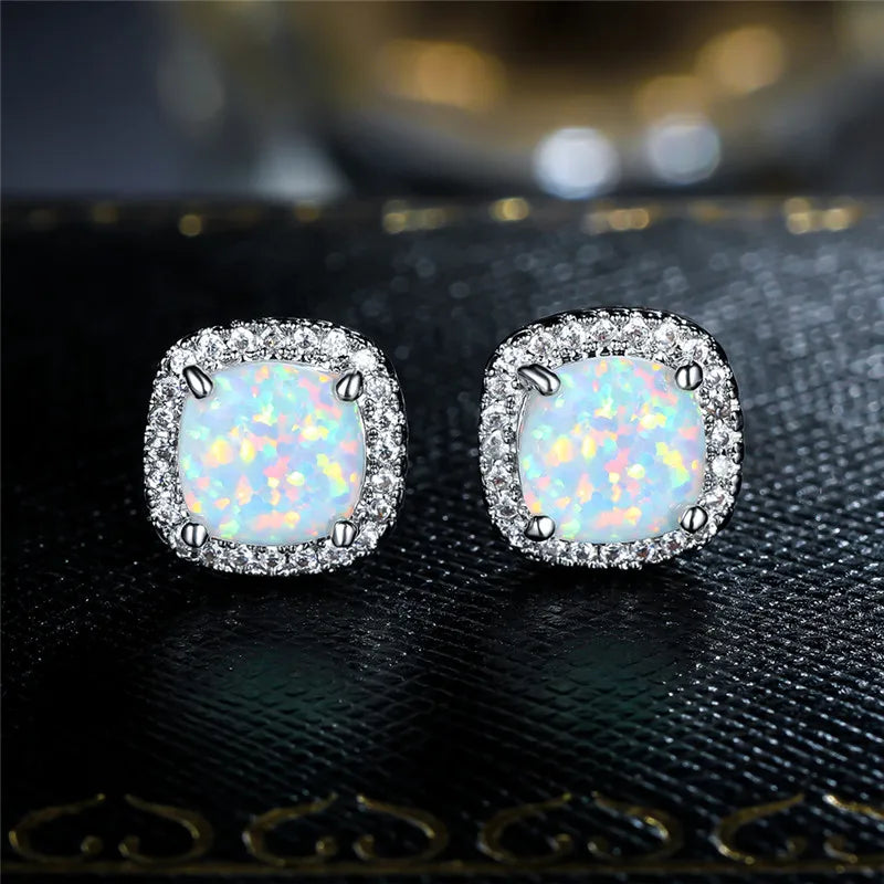 Elegant silver stud earrings with round white fire opals