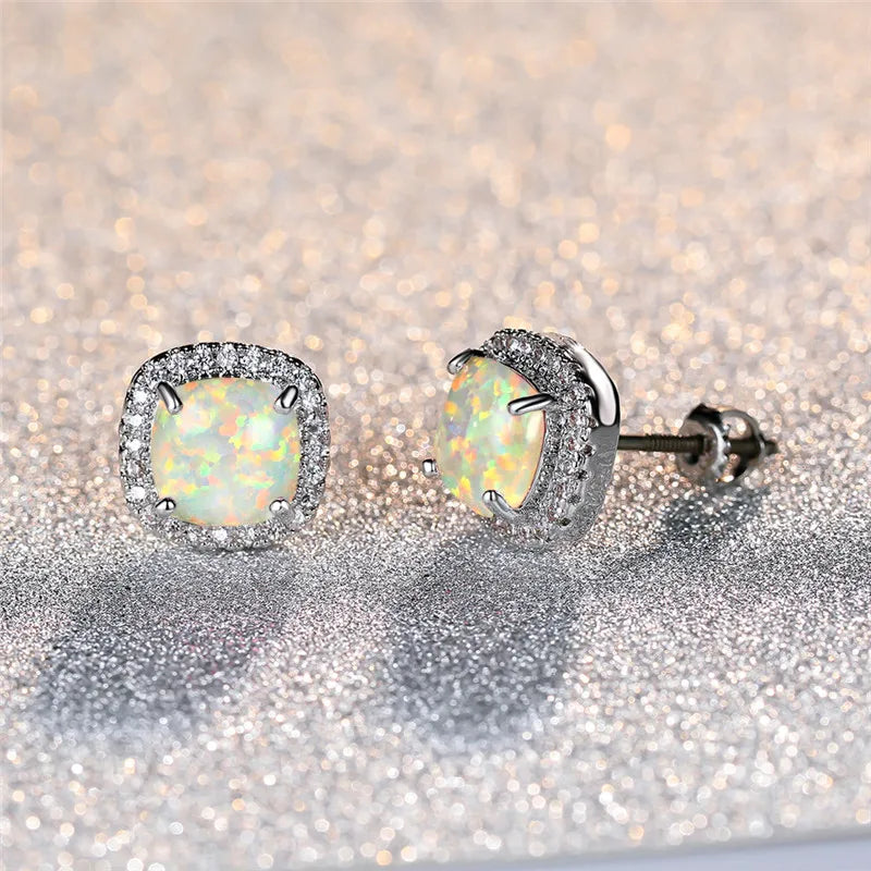Elegant silver stud earrings with round white fire opals