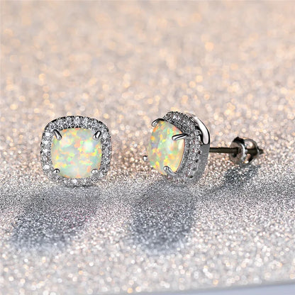 Elegant silver stud earrings with round white fire opals